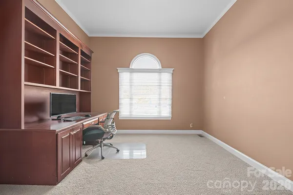 a workspace with furniture and window