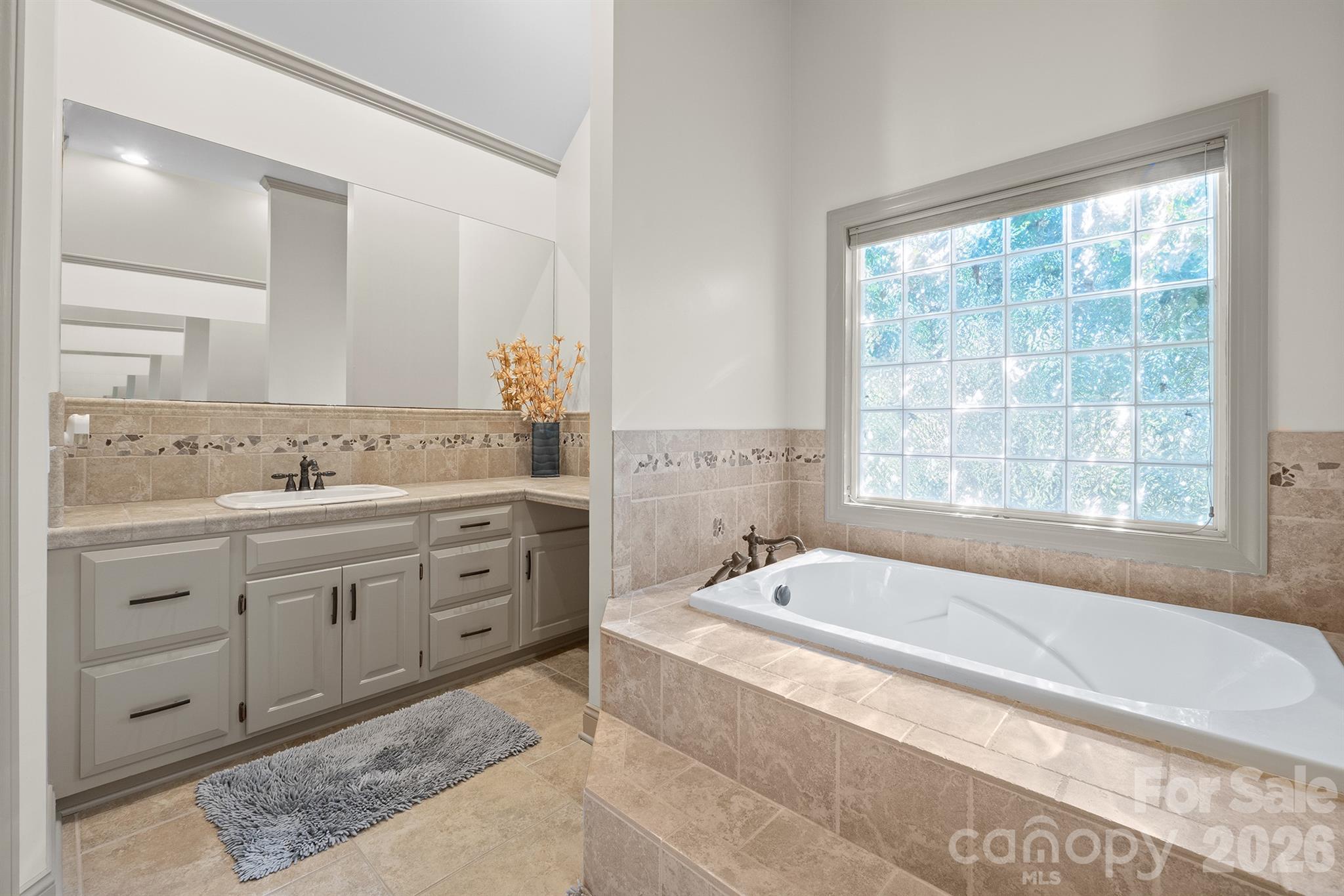 2425 Birdie Lane Northeast Conover, NC 28613 - Photo 17 of 43 a spacious bathroom with sink bathtub and window