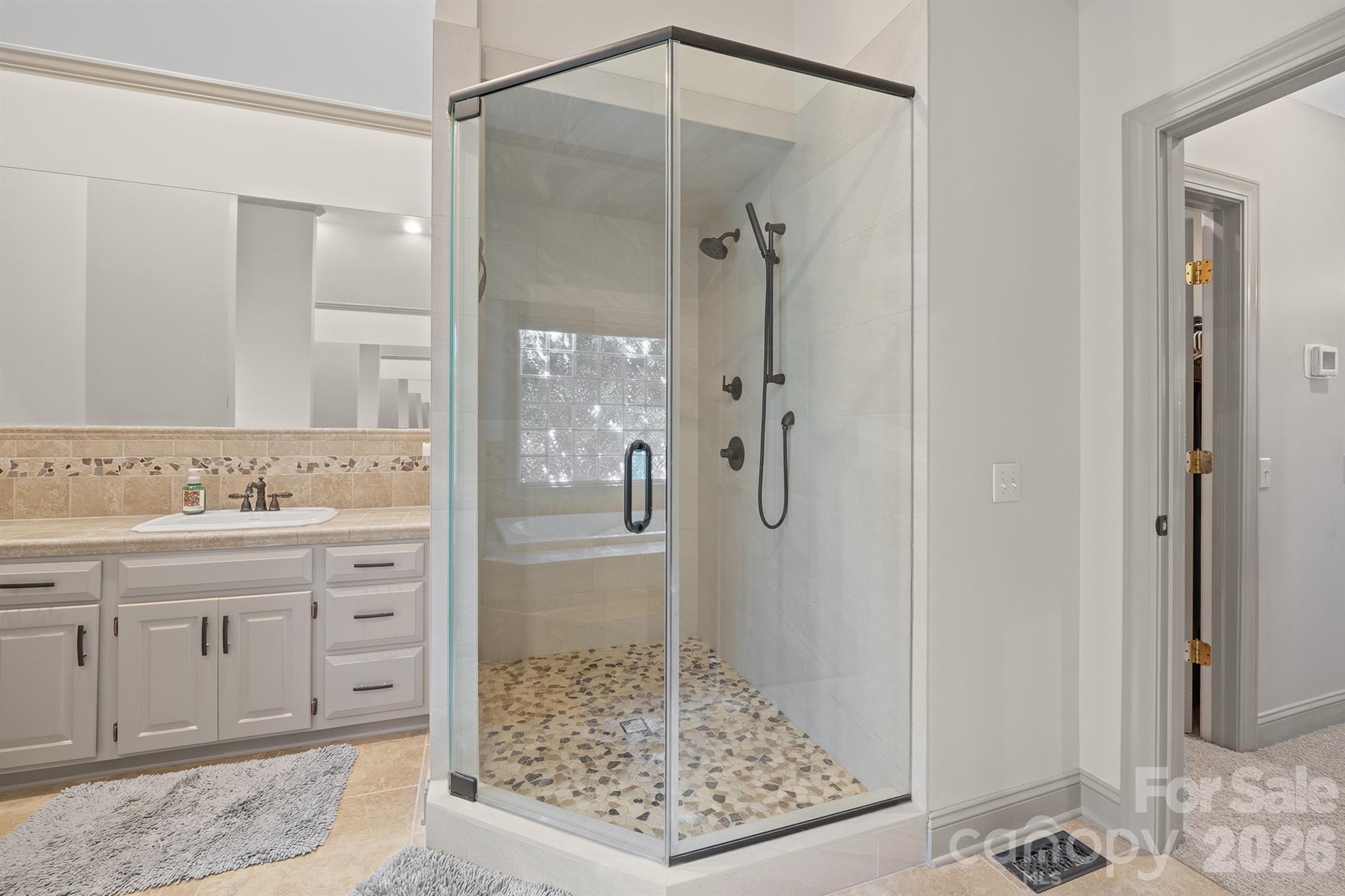 2425 Birdie Lane Northeast Conover, NC 28613 - Photo 18 of 43 a bathroom with a granite countertop sink a mirror and a shower