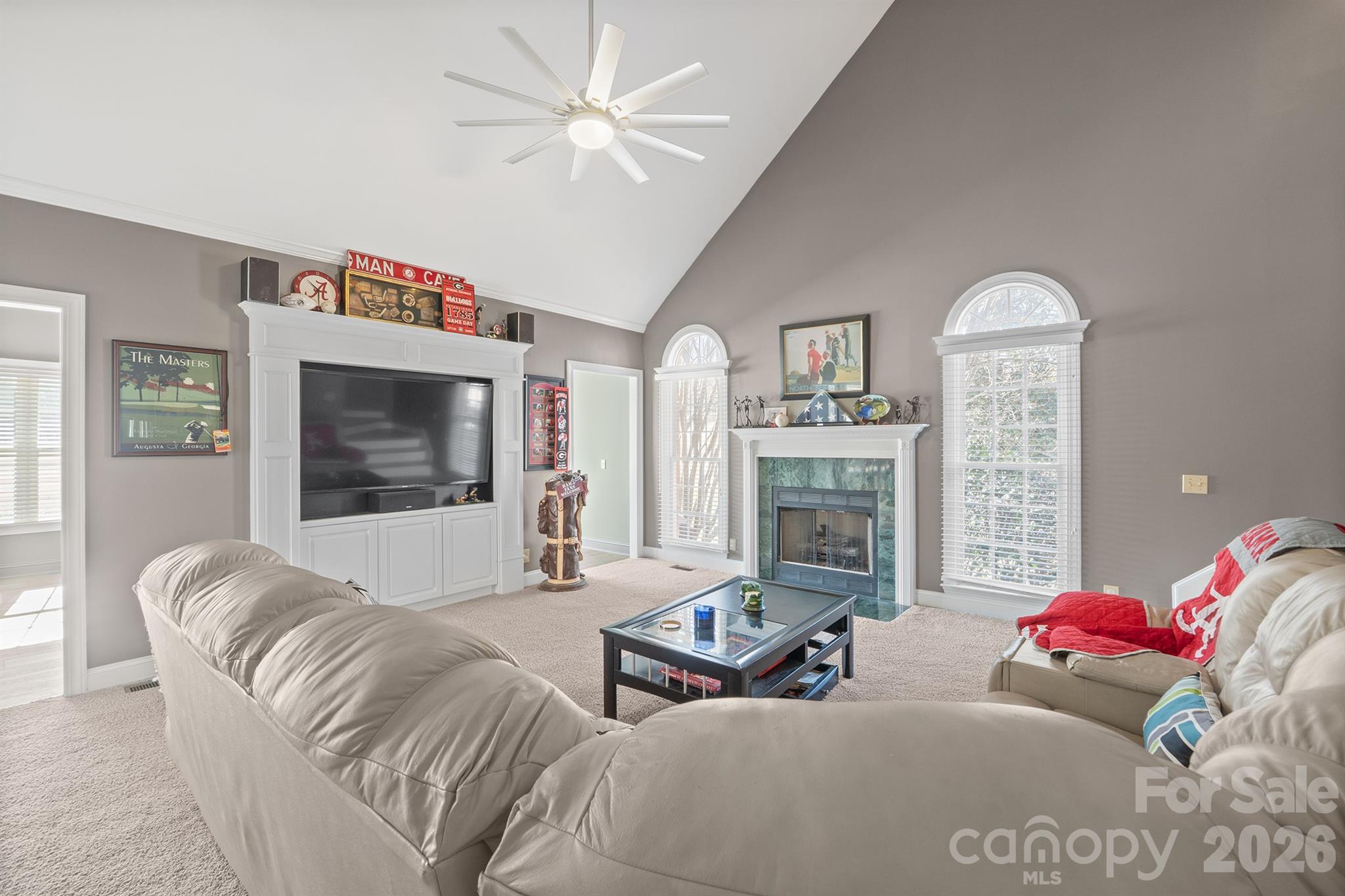 2425 Birdie Lane Northeast Conover, NC 28613 - Photo 22 of 43 a living room with furniture a fireplace and a flat screen tv