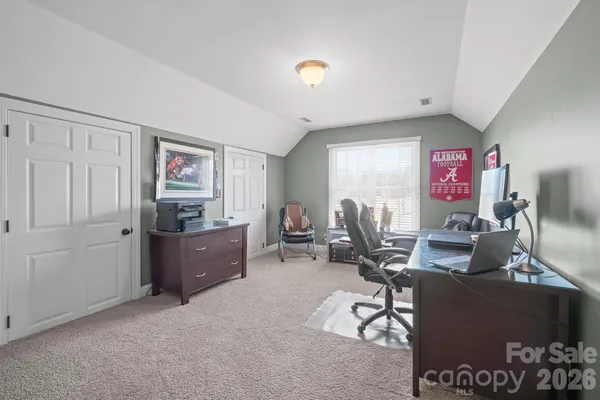 a view of a workspace with furniture