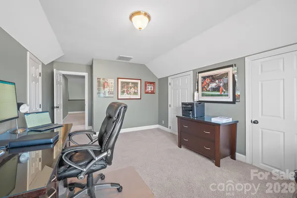 a workspace with furniture and window