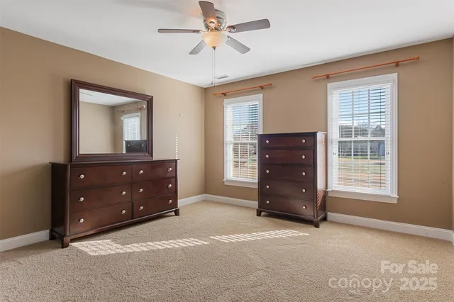 a room with a dresser and a window