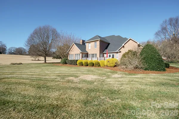 a view of a house with a big yard