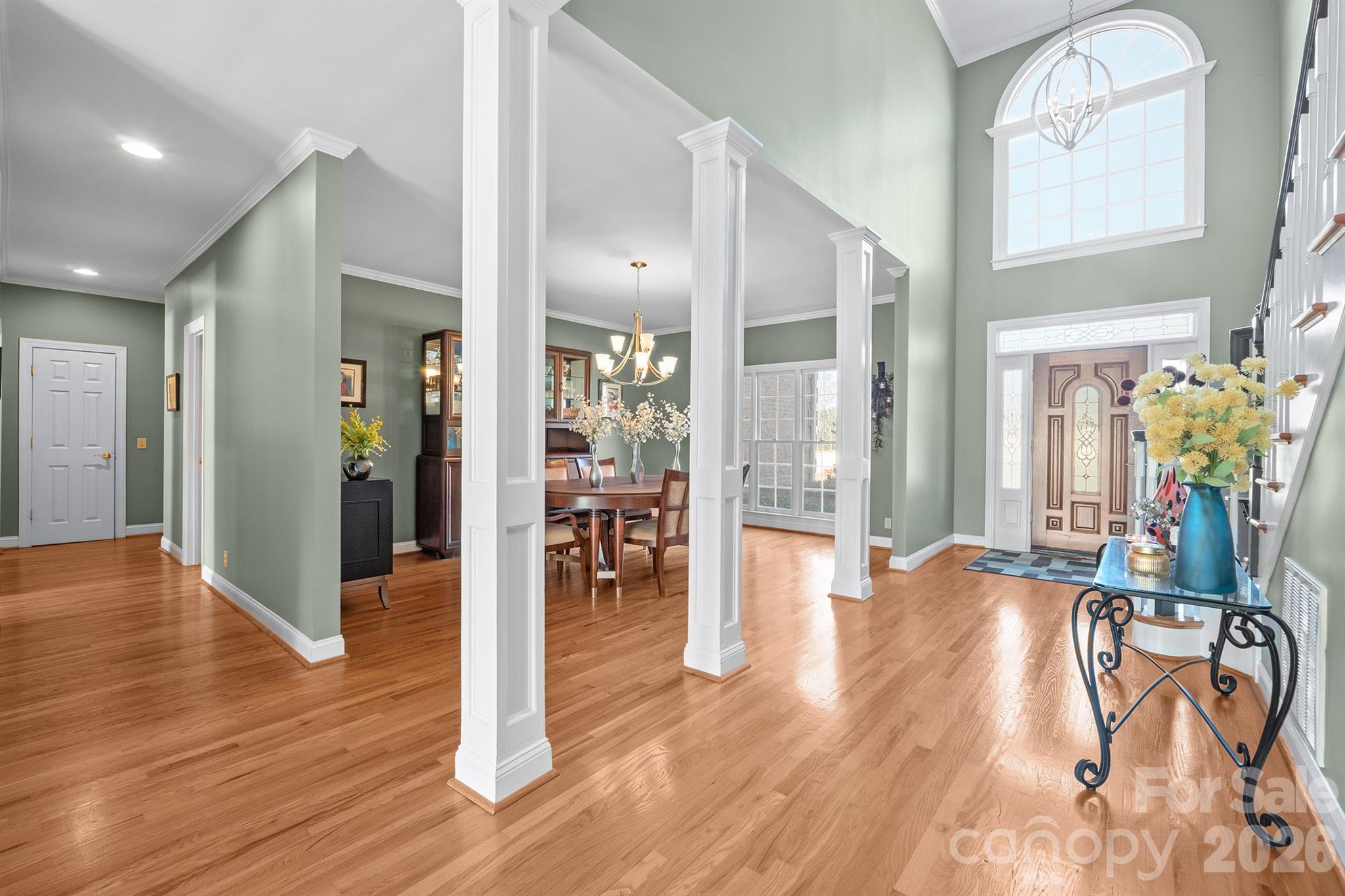 2425 Birdie Lane Northeast Conover, NC 28613 - Photo 4 of 43 a view of a hallway with wooden floor table and chairs