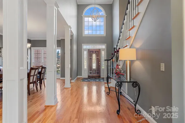a view of a entryway with furniture and wooden floor