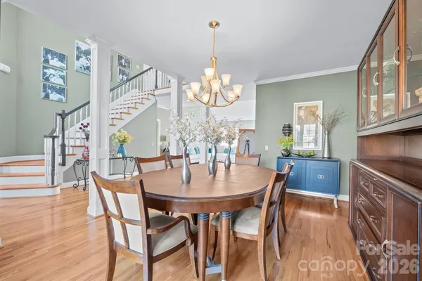 a view of a dining room with furniture and wooden floor