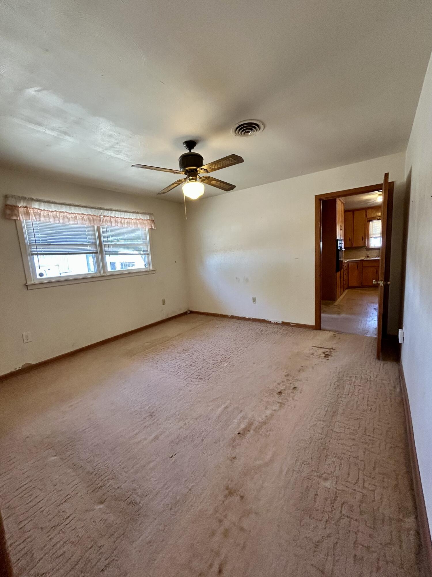 2101 Farm To Market 97 Lockney, TX 79241 - Photo 15 of 35 an empty room with windows and fan