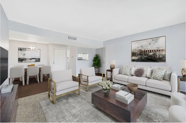 a living room with furniture and a table