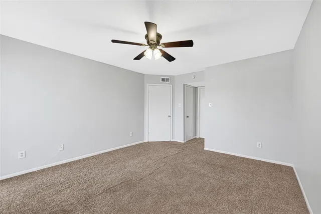 a view of a ceiling fan in a room