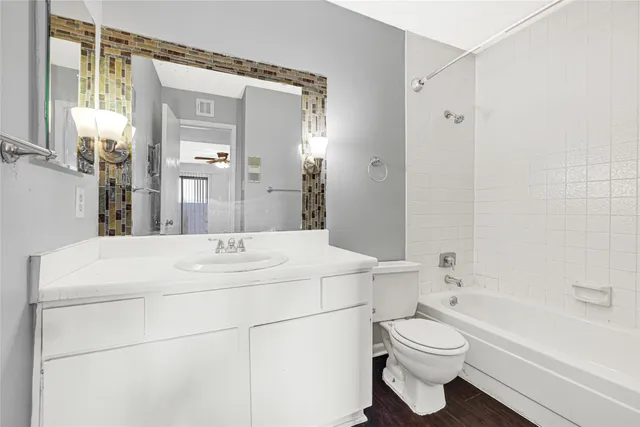 a bathroom with a sink a toilet and a bathtub