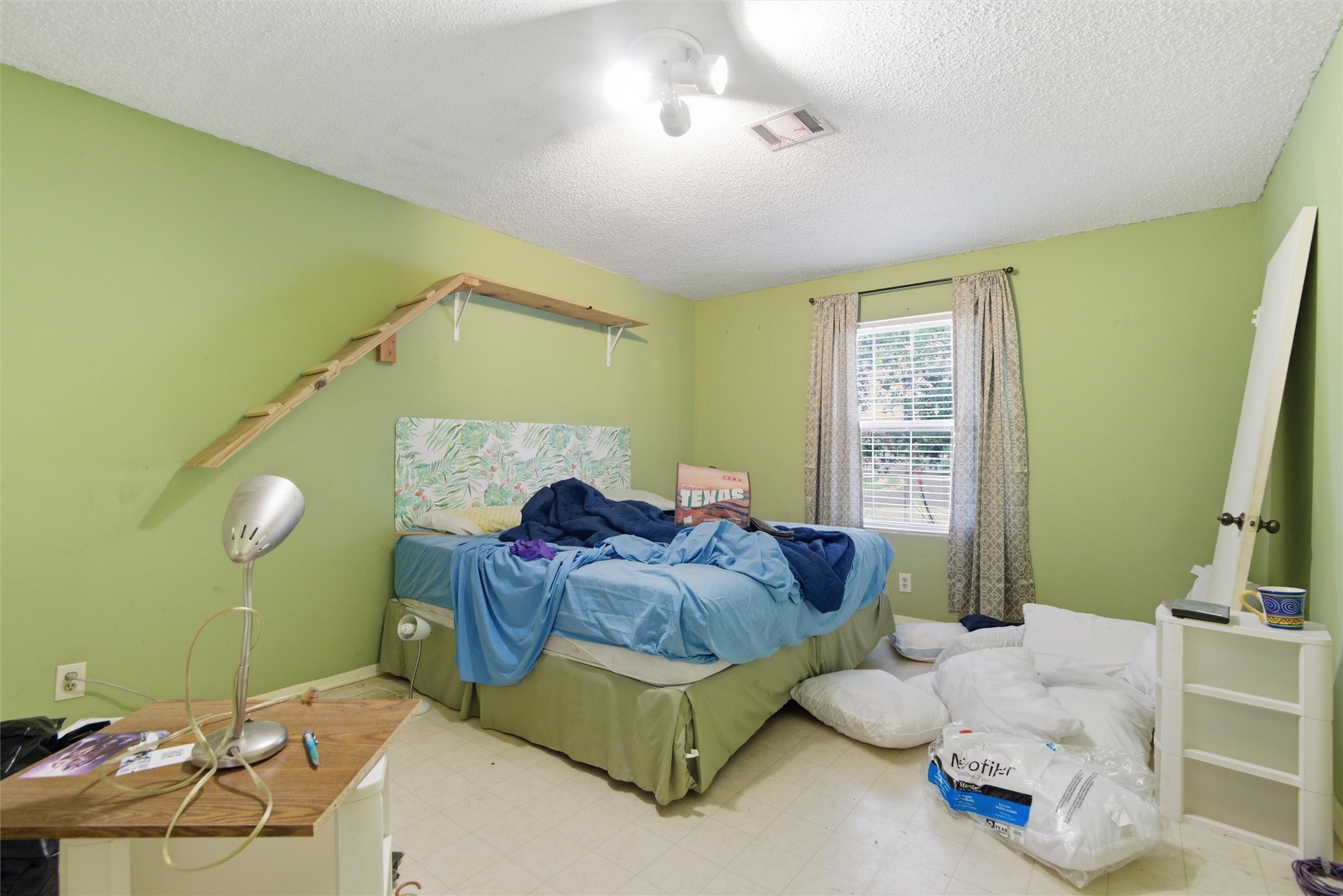 2000 Magazine Street Austin, TX 78727 - Photo 23 of 30 An inviting sleeping space with a window offering natural light.