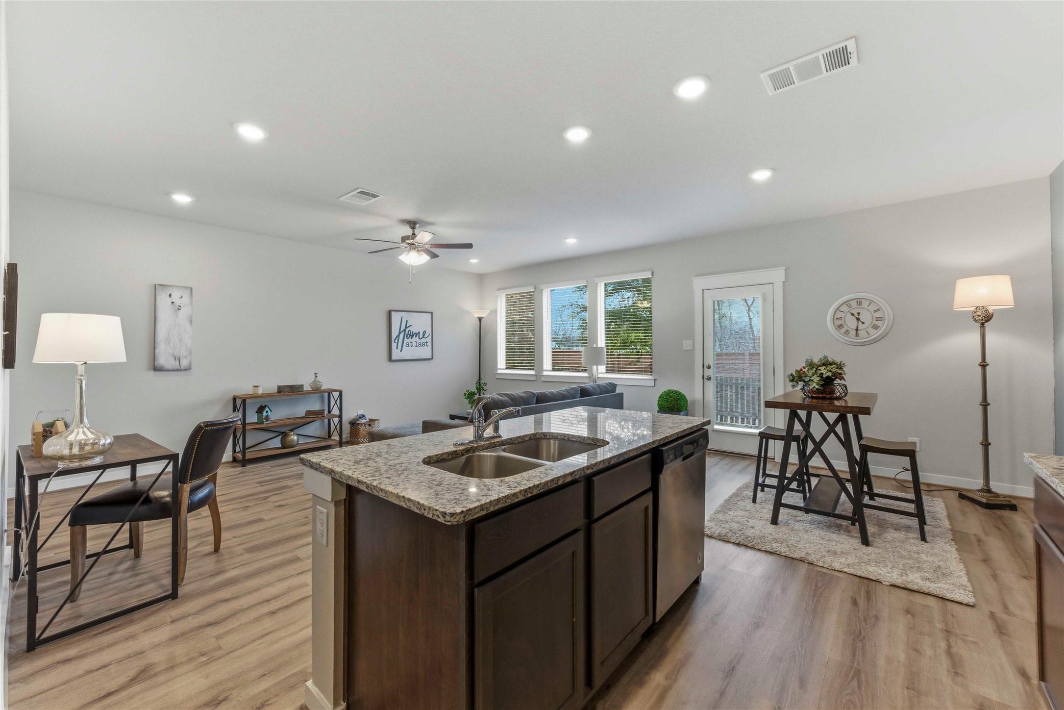 17203 Leafroller Drive, Unit B Pflugerville, TX 78660 - Photo 4 of 20 a living room with furniture and a wooden floor