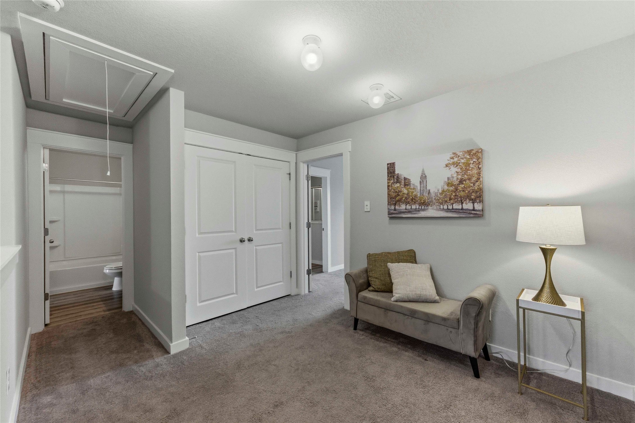 17203 Leafroller Drive, Unit B Pflugerville, TX 78660 - Photo 10 of 20 a living room with furniture and a lamp