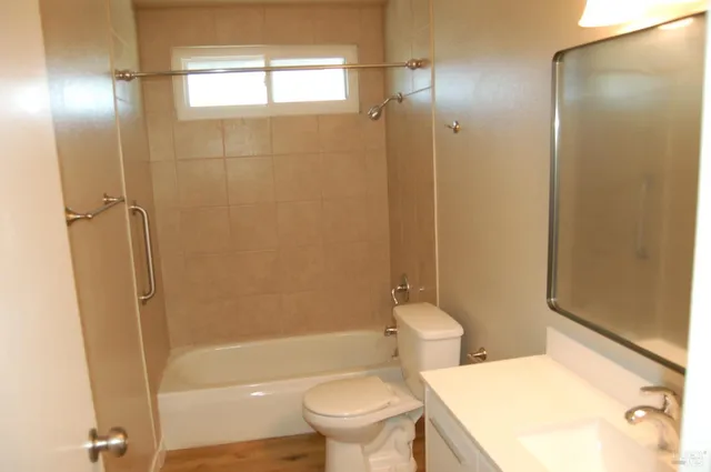 a bathroom with a bathtub and a toilet