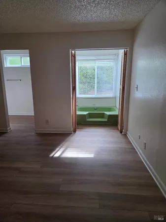 a view of room with window and hardwood