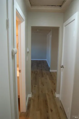 a view of a bathroom from a hallway