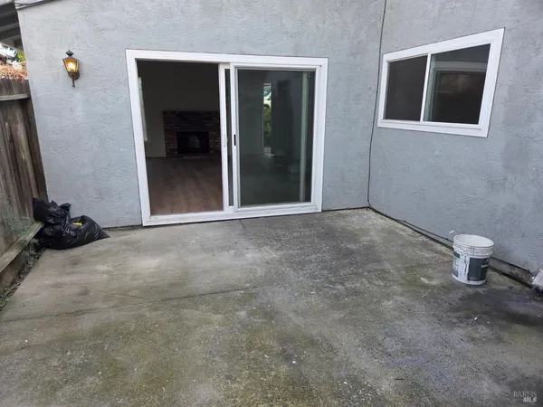 a view of an empty room and a bathroom