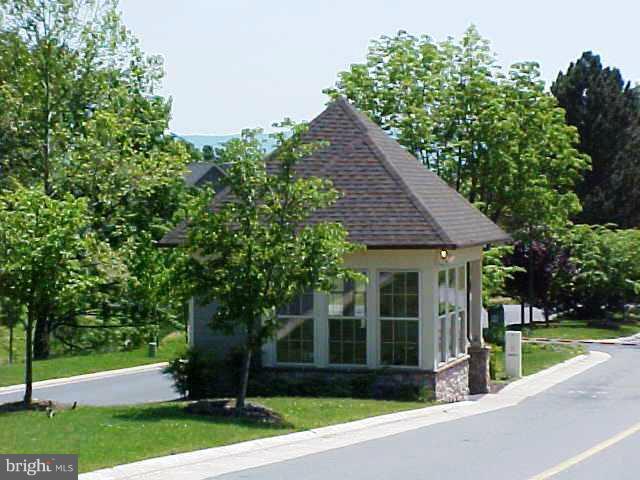168 Holiday Road Cross Junction, VA 22625 - Photo 15 of 29 a view of a brick house with a large windows plants and large trees