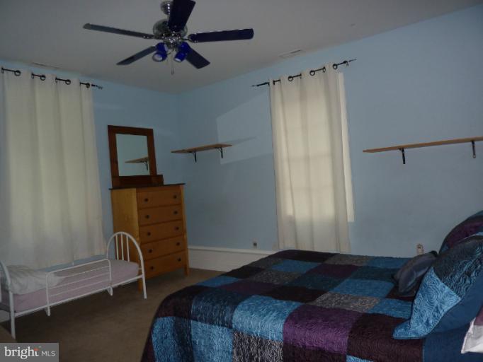 168 Holiday Road Cross Junction, VA 22625 - Photo 23 of 29 a bedroom with a bed and a window
