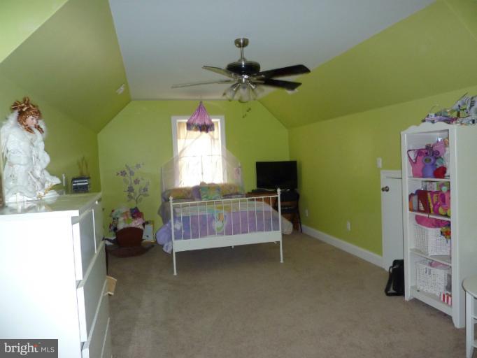 168 Holiday Road Cross Junction, VA 22625 - Photo 25 of 29 a bedroom with a bed and a chandelier