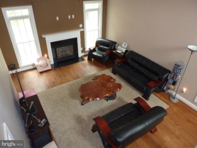 168 Holiday Road Cross Junction, VA 22625 - Photo 26 of 29 a living room with furniture and a fireplace