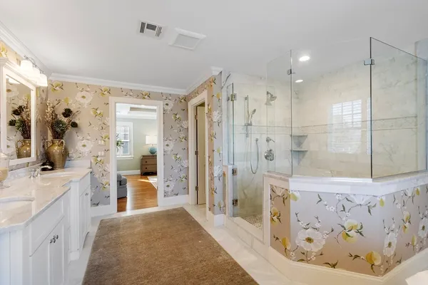 a bathroom with a bathtub shower sink and mirror
