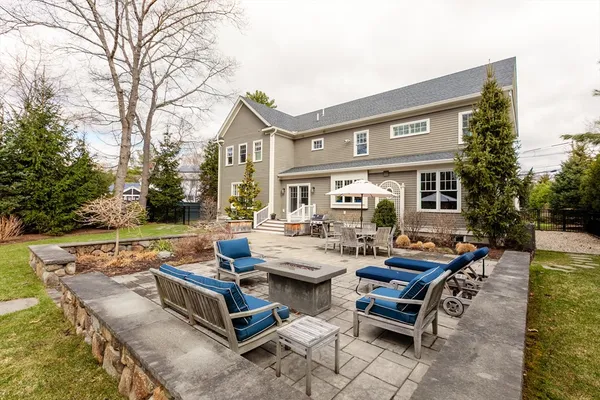 a view of a patio with swimming pool table and chairs