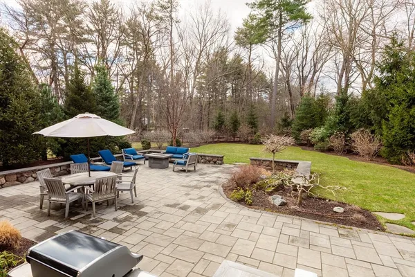 a view of a backyard with sitting area