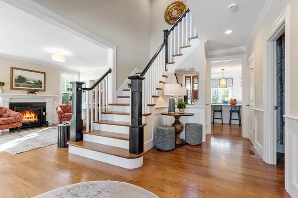 a view of entryway livingroom and hall with wooden floor