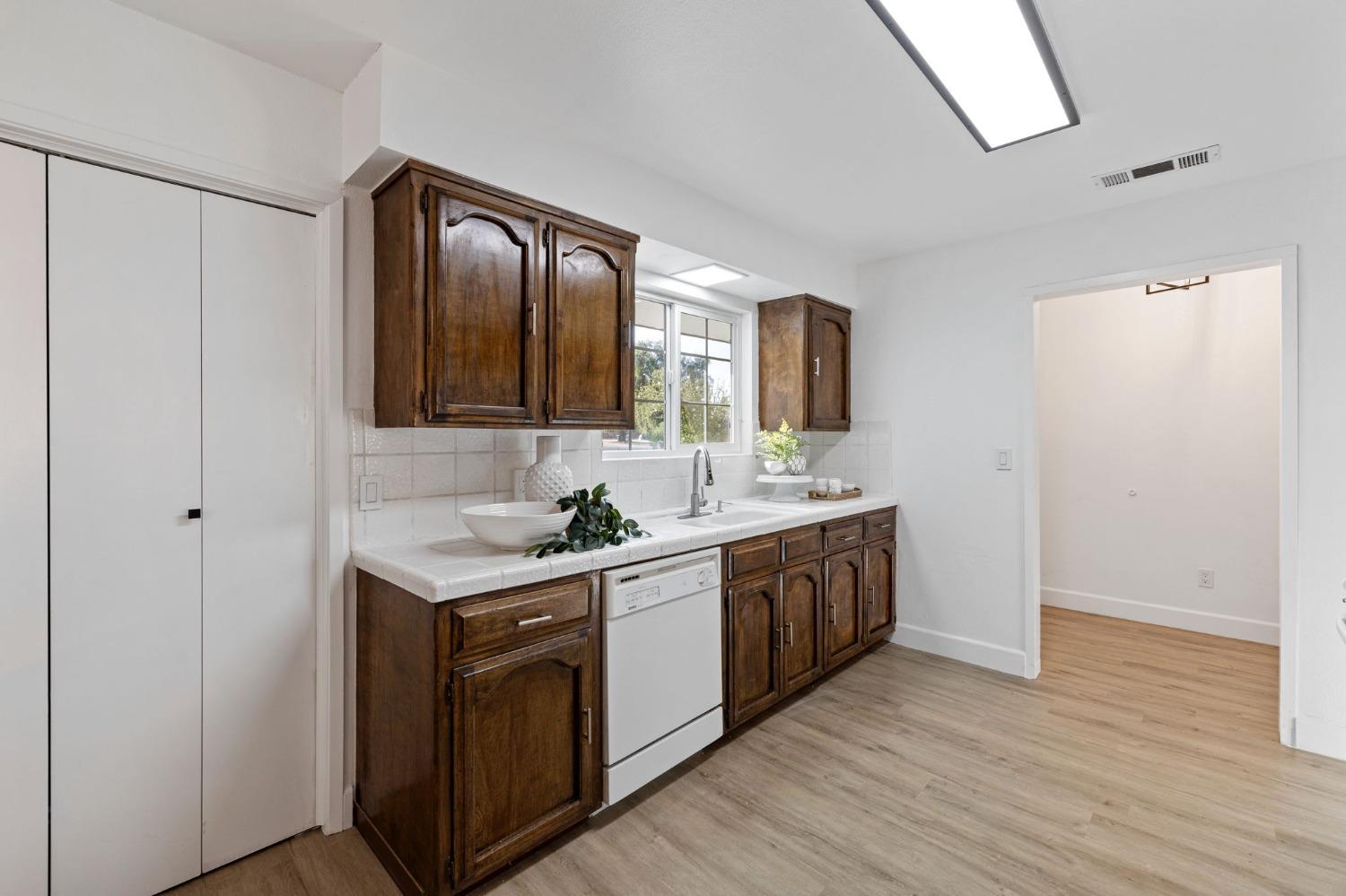 17153 Rodeo Drive Madera, CA 93638 - Photo 11 of 22 a bathroom with a granite countertop double vanity sink and mirror