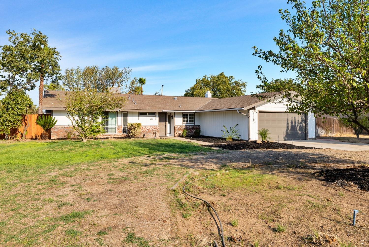 17153 Rodeo Drive Madera, CA 93638 - Photo 3 of 22 a view of a house with a yard