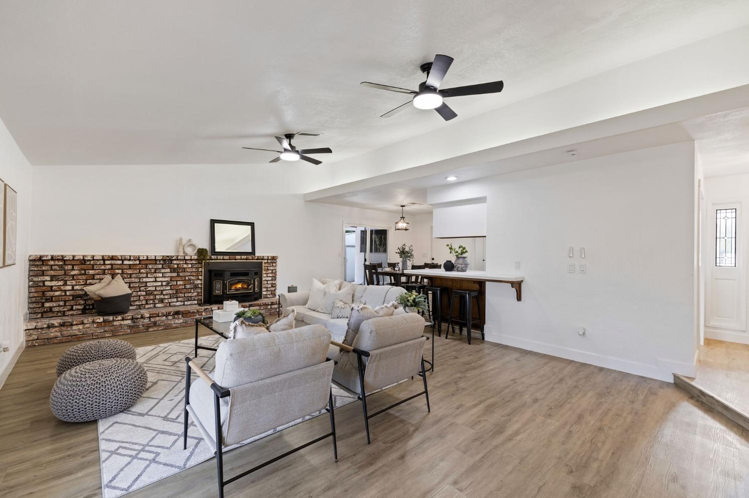 17153 Rodeo Drive Madera, CA 93638 - Photo 6 of 22 a living room with furniture and a fireplace