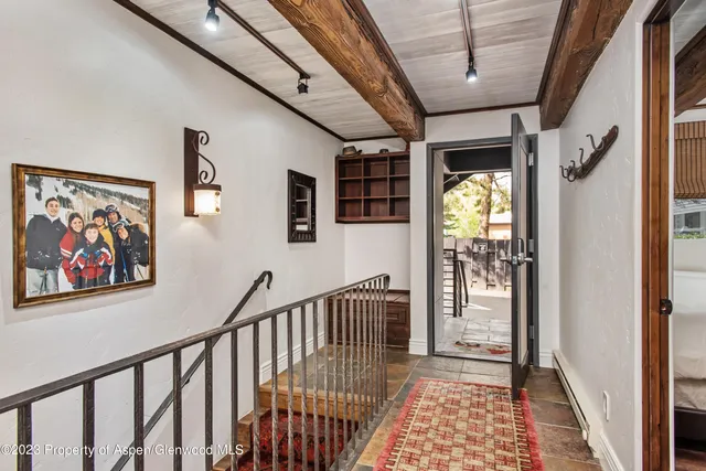 a bedroom with two beds and a window