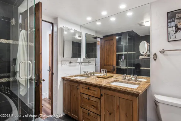 a bathroom with a bathtub and a shower