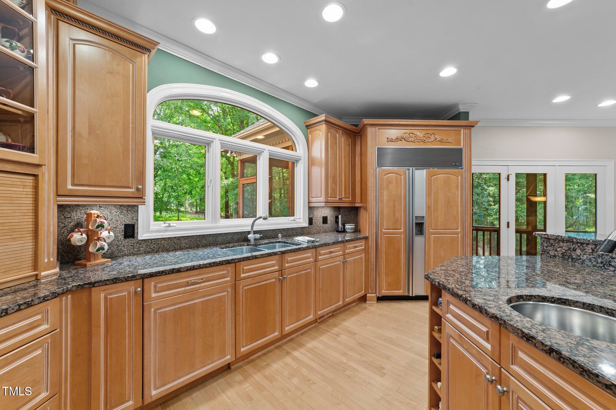 12504 Bayleaf Church Road Raleigh, NC 27614 - Photo 11 of 73 a kitchen with stainless steel appliances granite countertop a sink a stove and a refrigerator