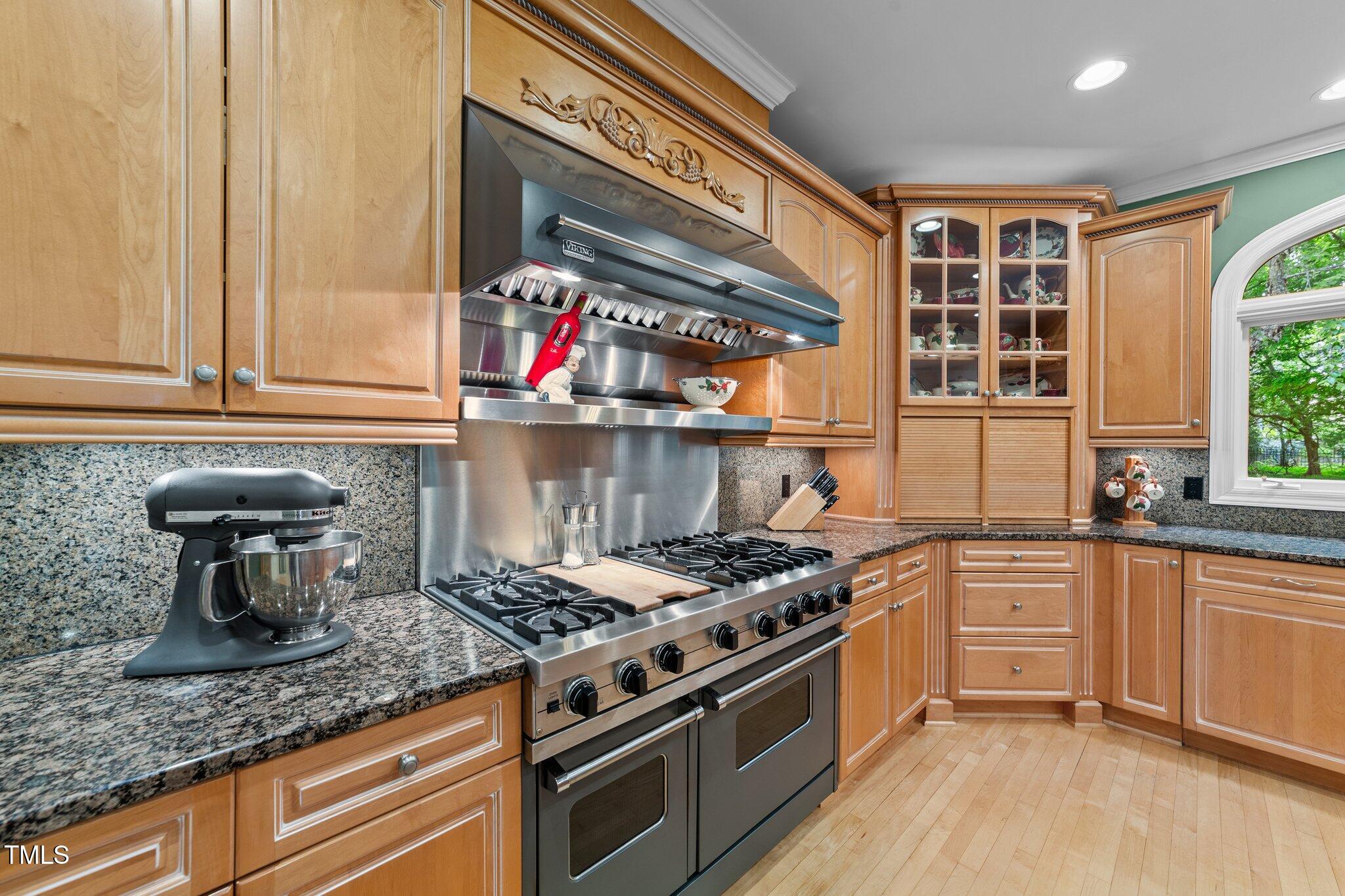 12504 Bayleaf Church Road Raleigh, NC 27614 - Photo 12 of 73 a kitchen with stainless steel appliances granite countertop a stove and a sink
