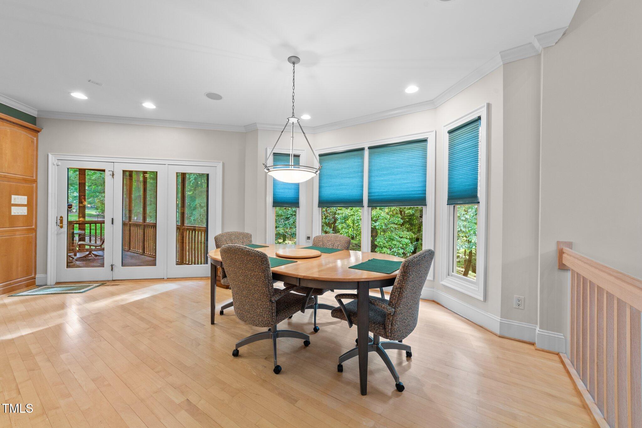 12504 Bayleaf Church Road Raleigh, NC 27614 - Photo 15 of 73 a dining room with furniture window wooden floor