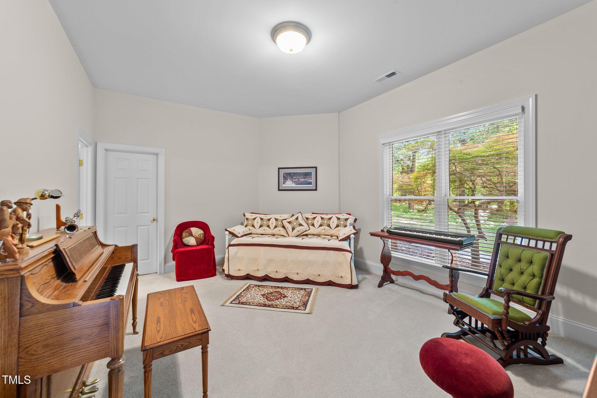 12504 Bayleaf Church Road Raleigh, NC 27614 - Photo 46 of 73 a bedroom with furniture and a window