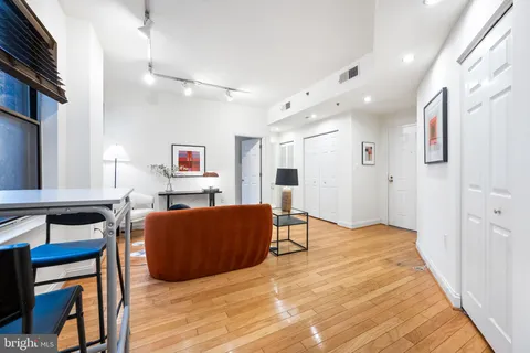 a view of furniture and wooden floor in a kitchen
