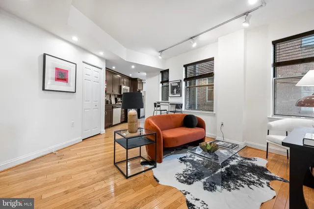 a bedroom with furniture and a book shelf
