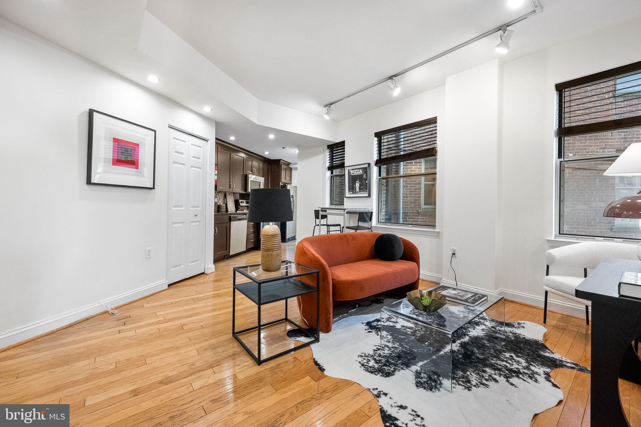 1621 T Street Northwest, Unit 207 Washington, DC 20009 - Photo 19 of 29 a bedroom with furniture and a book shelf
