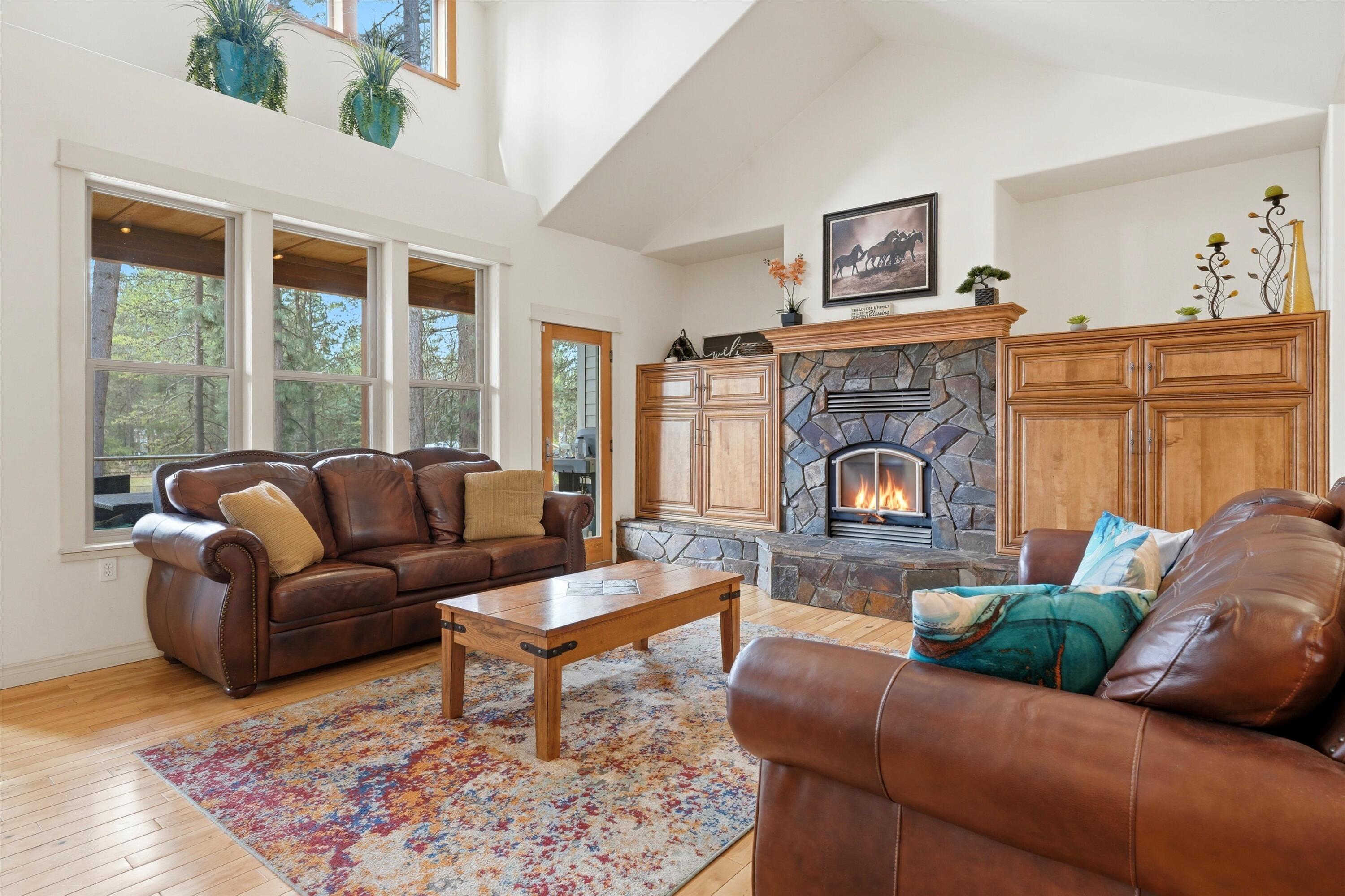 17179 Island Loop Way Bend, OR 97707 - Photo 7 of 52 a living room with furniture and a fireplace