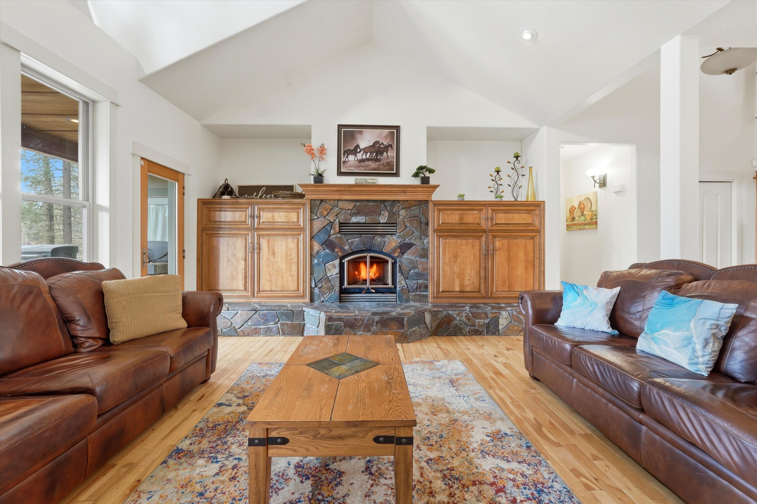 17179 Island Loop Way Bend, OR 97707 - Photo 8 of 52 a living room with furniture and a fireplace