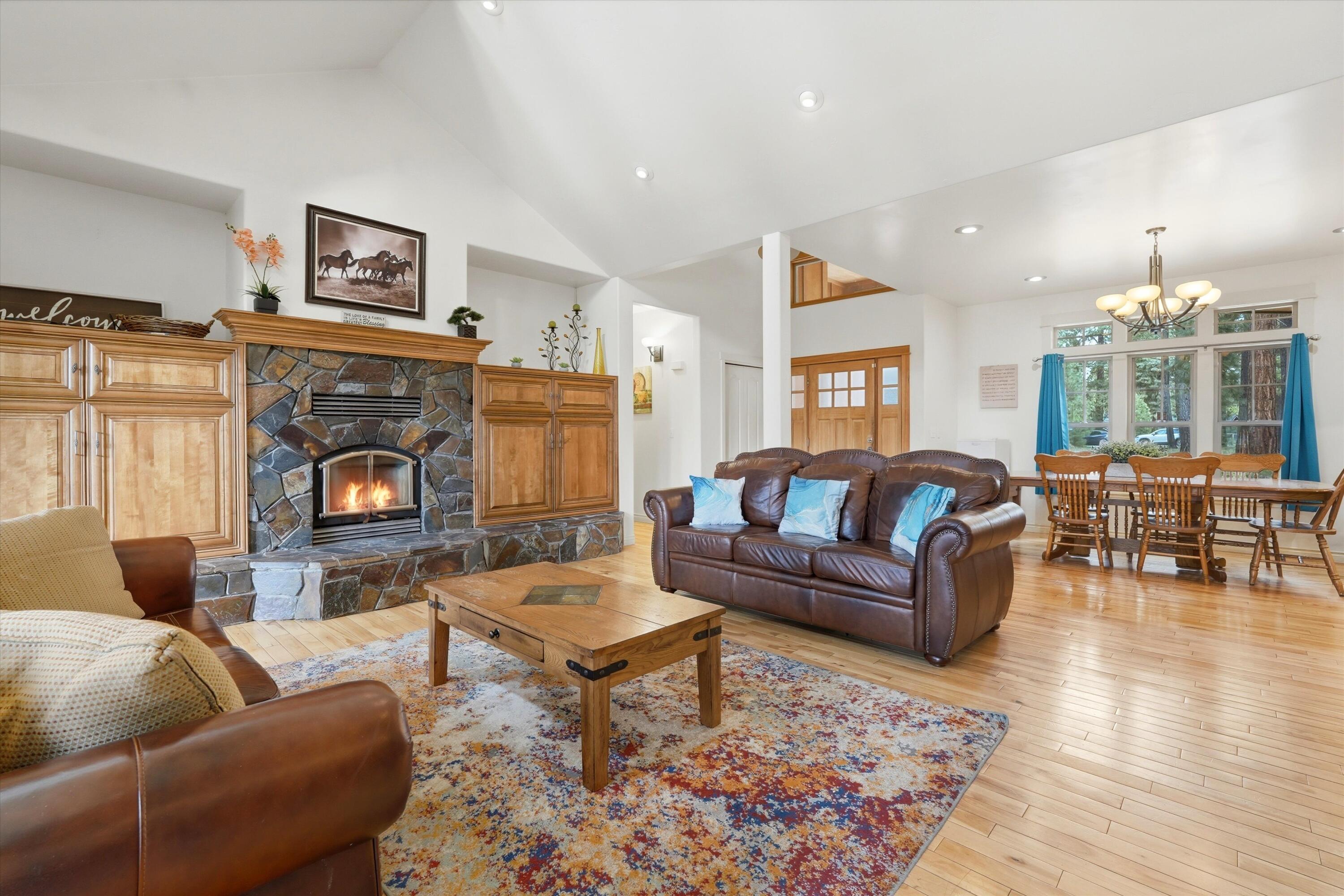 17179 Island Loop Way Bend, OR 97707 - Photo 9 of 52 a living room with fireplace furniture and a fireplace