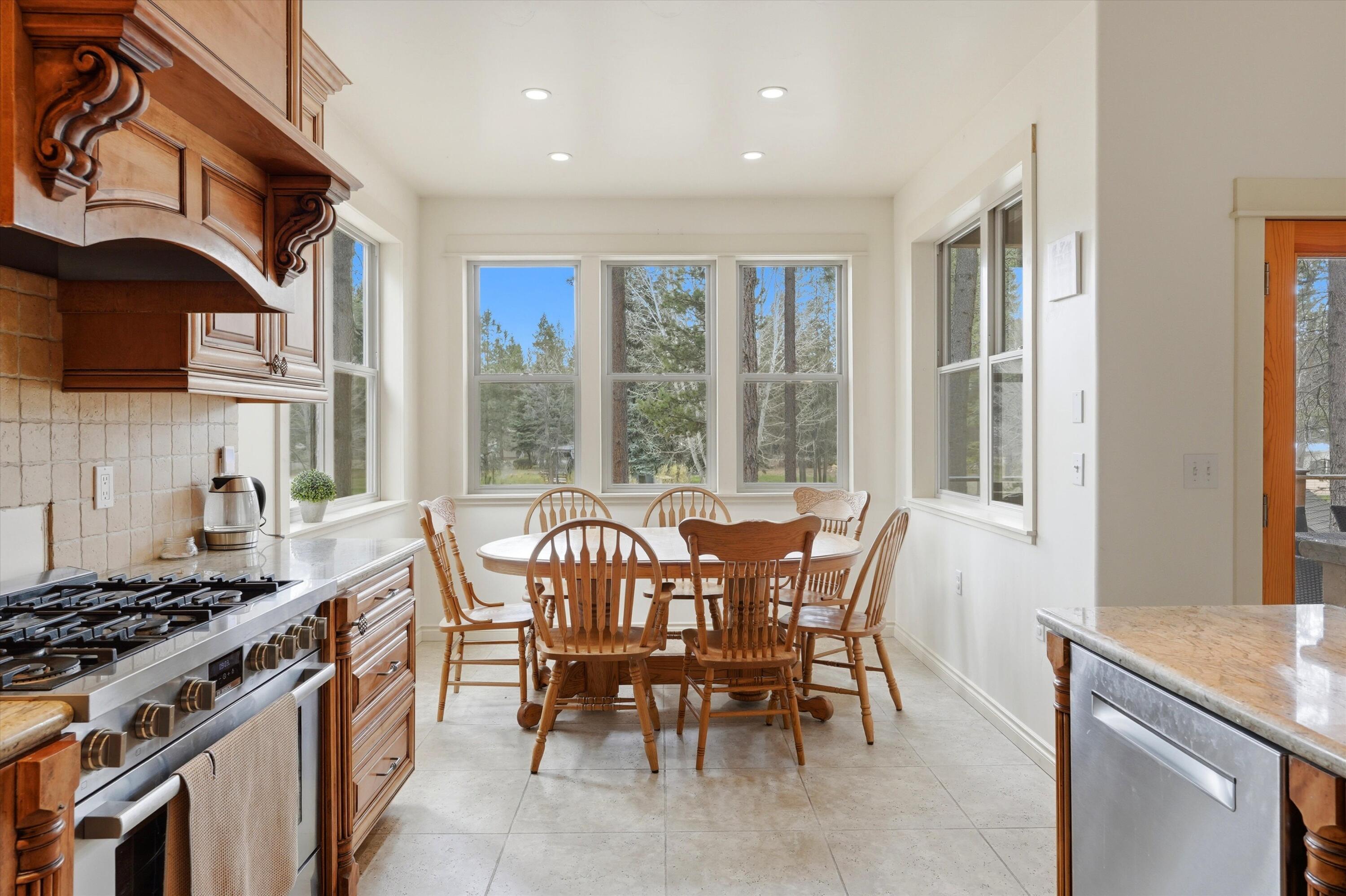 17179 Island Loop Way Bend, OR 97707 - Photo 18 of 52 a view of a dining room with furniture window and outside view