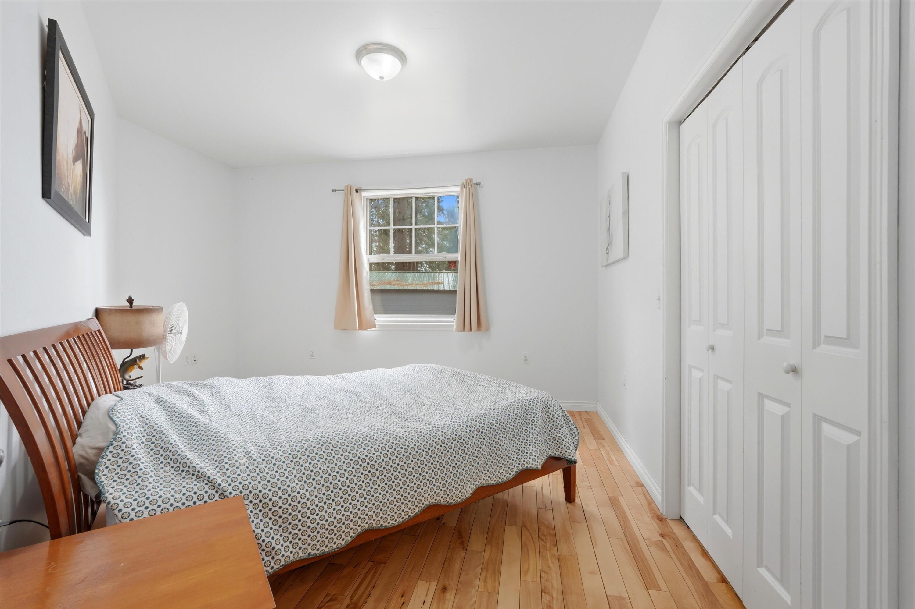17179 Island Loop Way Bend, OR 97707 - Photo 21 of 52 a bedroom with a bed and a window