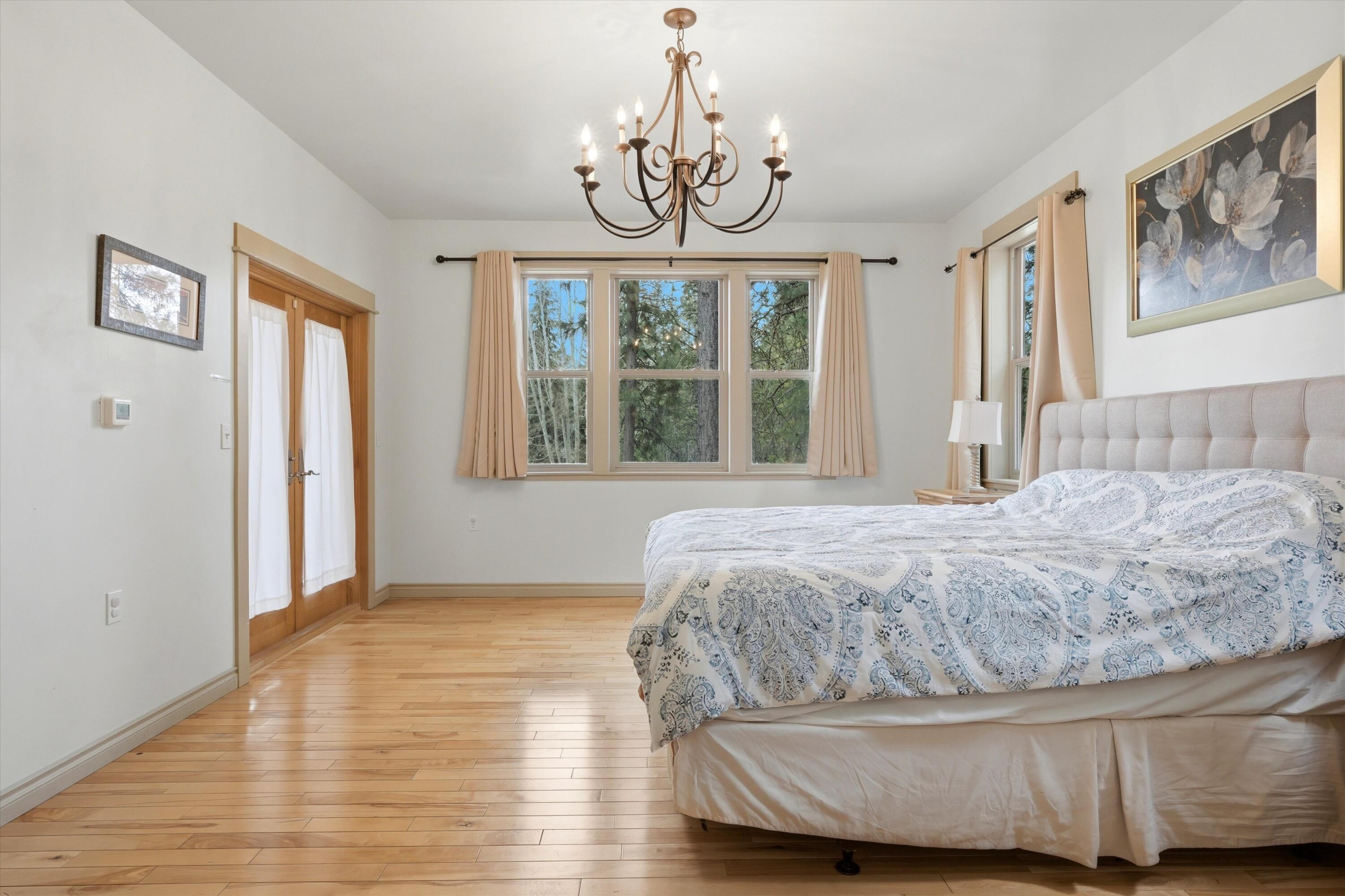 17179 Island Loop Way Bend, OR 97707 - Photo 23 of 52 a bedroom with a bed and a window