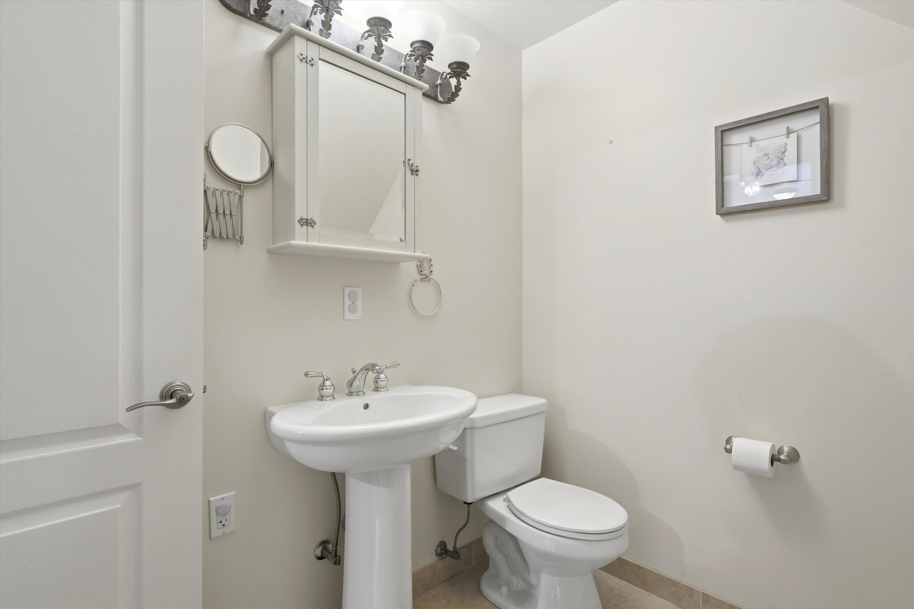 17179 Island Loop Way Bend, OR 97707 - Photo 30 of 52 a bathroom with a toilet sink and mirror