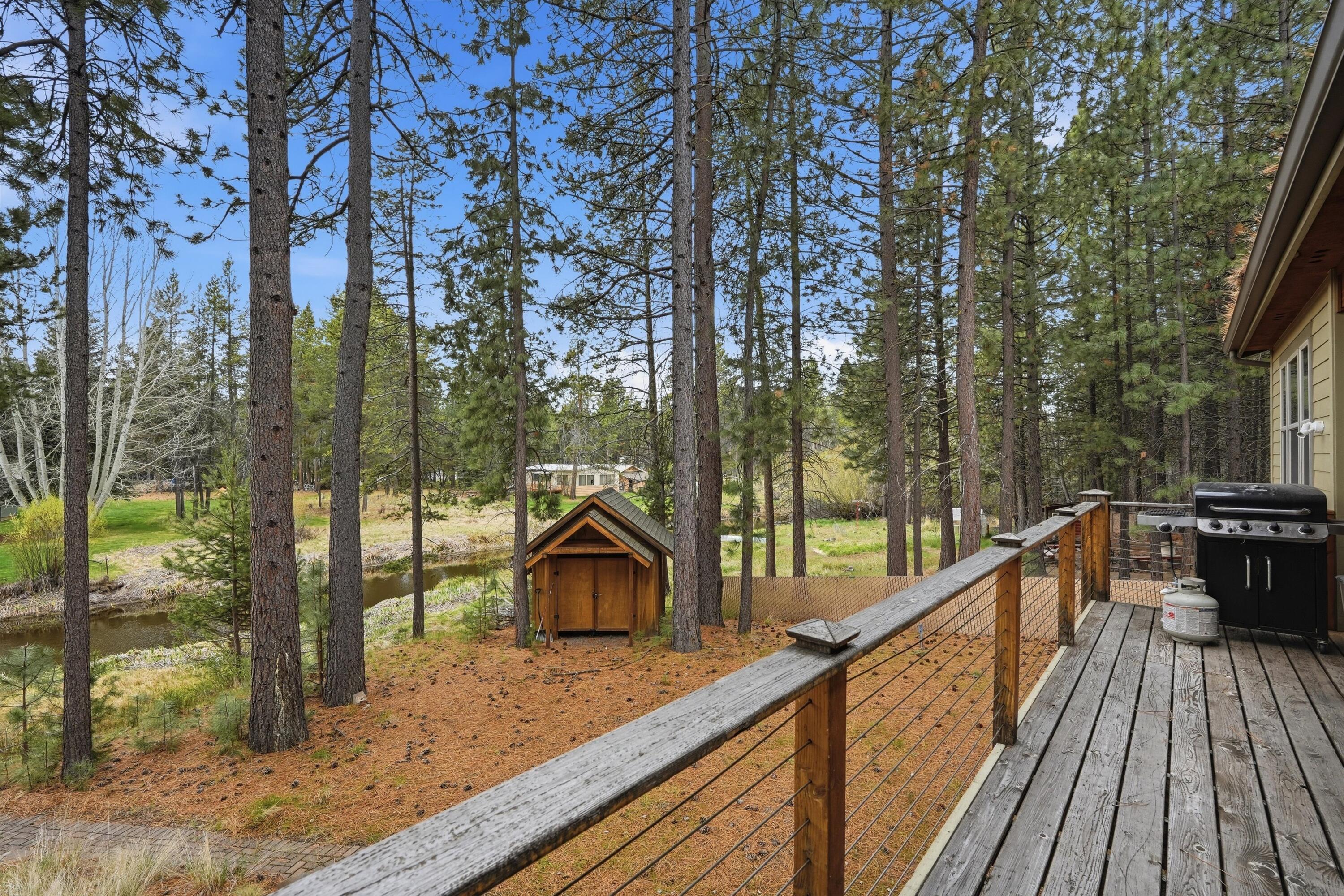 17179 Island Loop Way Bend, OR 97707 - Photo 34 of 52 a view of balcony with wooden floor and fence